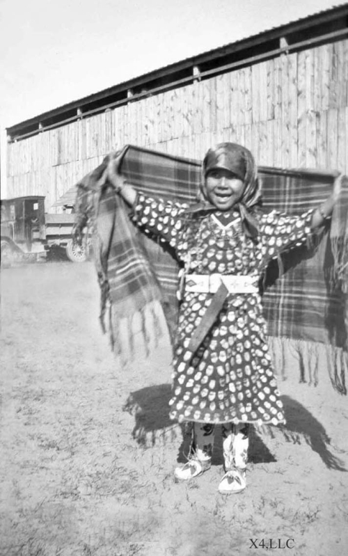 A young Crow girl in her elk tooth dress, 1920s.